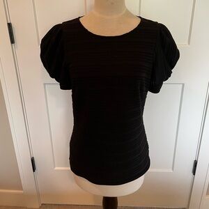 WHBM black textured puff short sleeve blouse, fully lined.